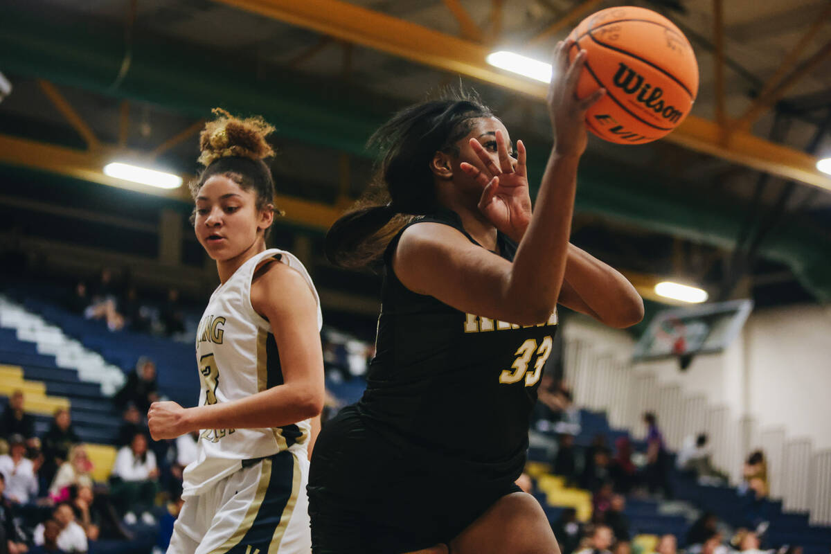 Democracy Prep power forward Heaven Spencer (33) passes the ball to a teammate during a game ag ...