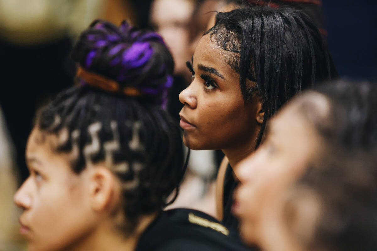 The Democracy Prep girls basketball team listen to speeches from their coaches in the locker ro ...