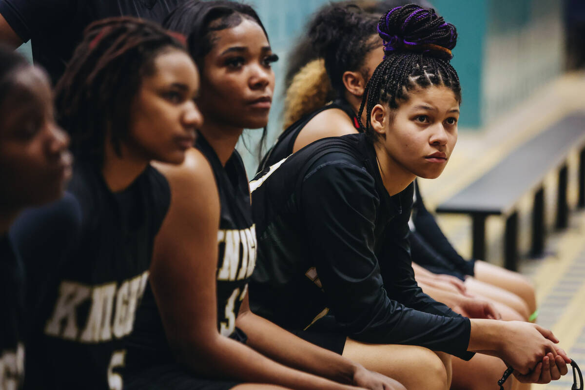 The Democracy Prep girls basketball team listen to speeches from their coaches in the locker ro ...