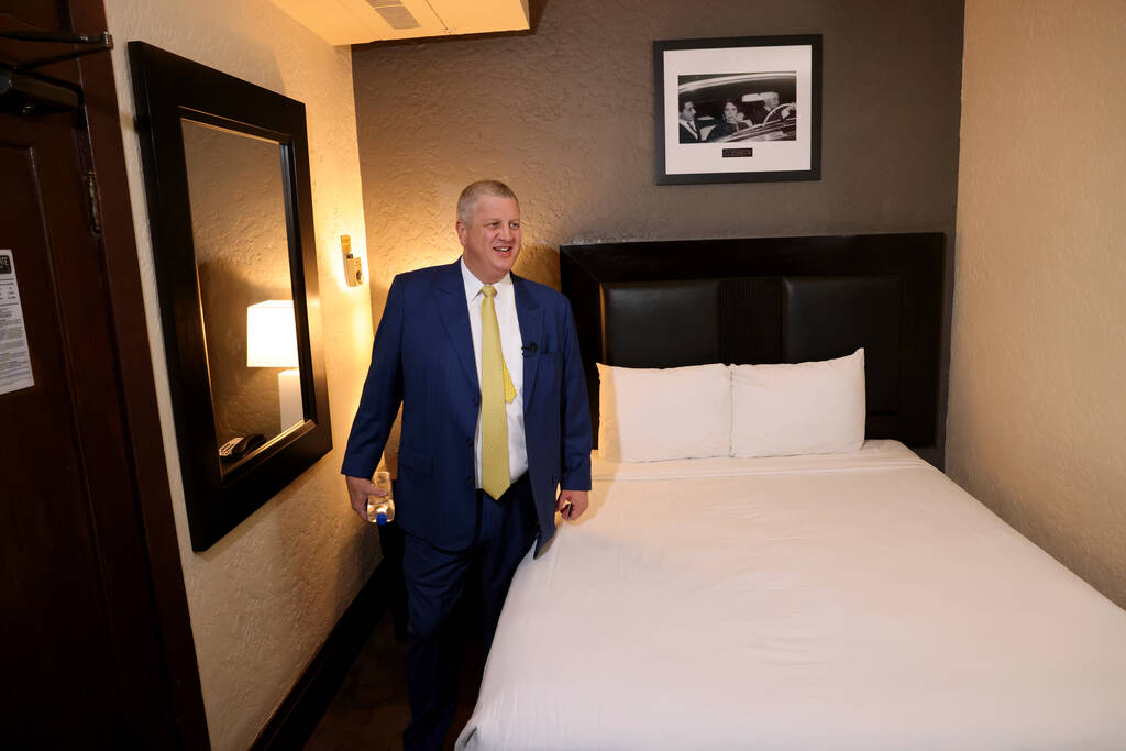 Golden Gate CEO Derek Stevens shows one of the original 10 rooms at his hotel during a celebrat ...