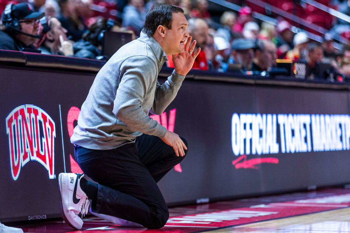 UNLV head coach Kevin Kruger calls a play against the Utah State Aggies during the first half o ...
