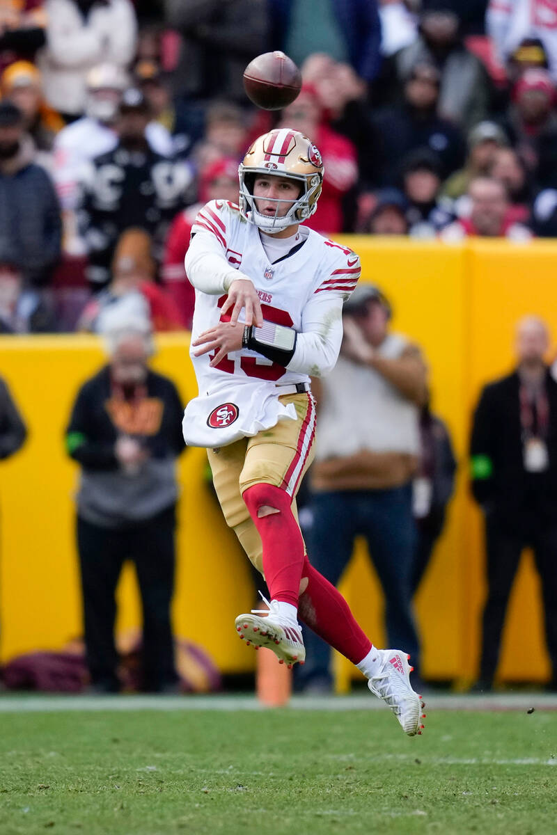 San Francisco 49ers quarterback Brock Purdy (13) throws a pass during the second half of an NFL ...