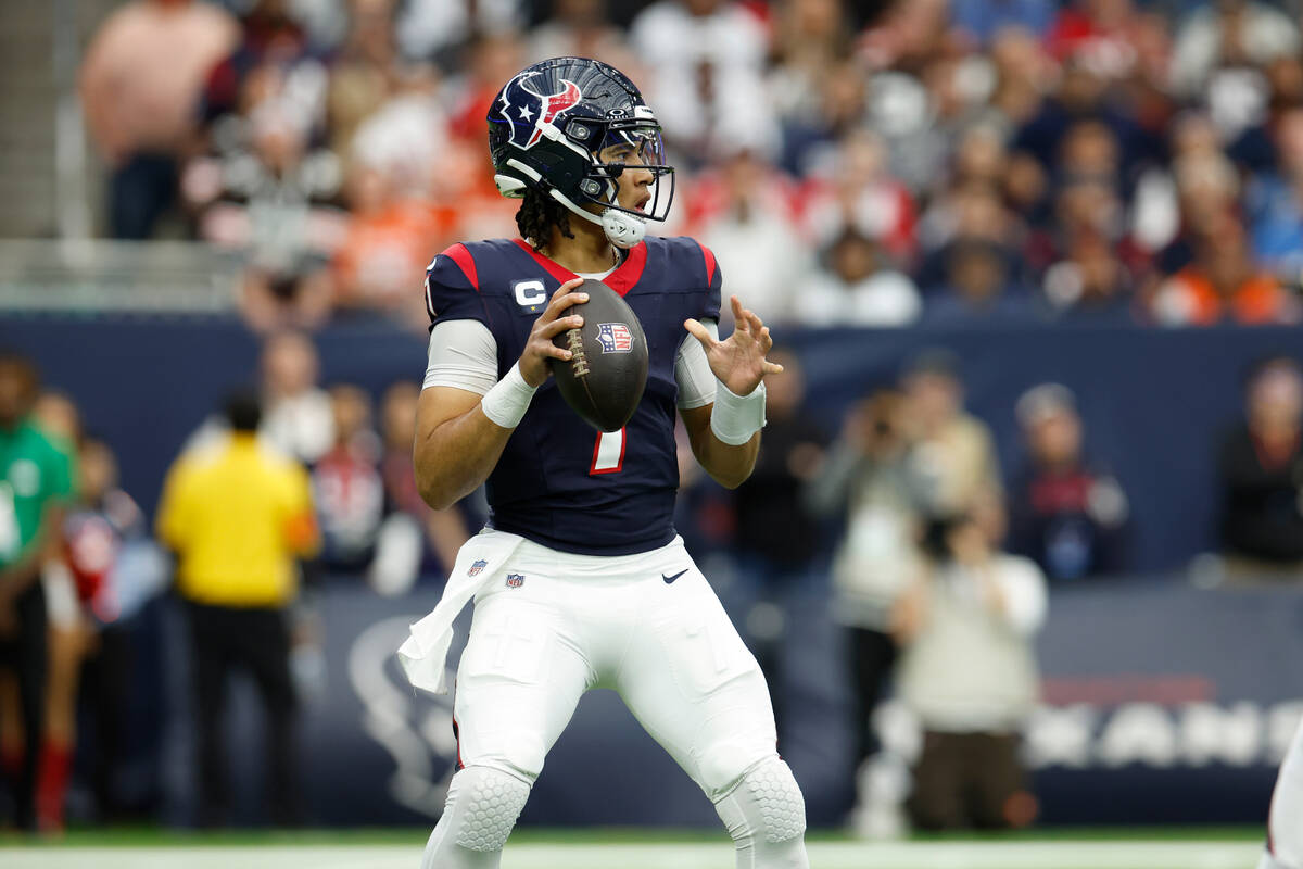 Houston Texans quarterback C.J. Stroud (7) looks to pass during an NFL wild-card playoff footba ...
