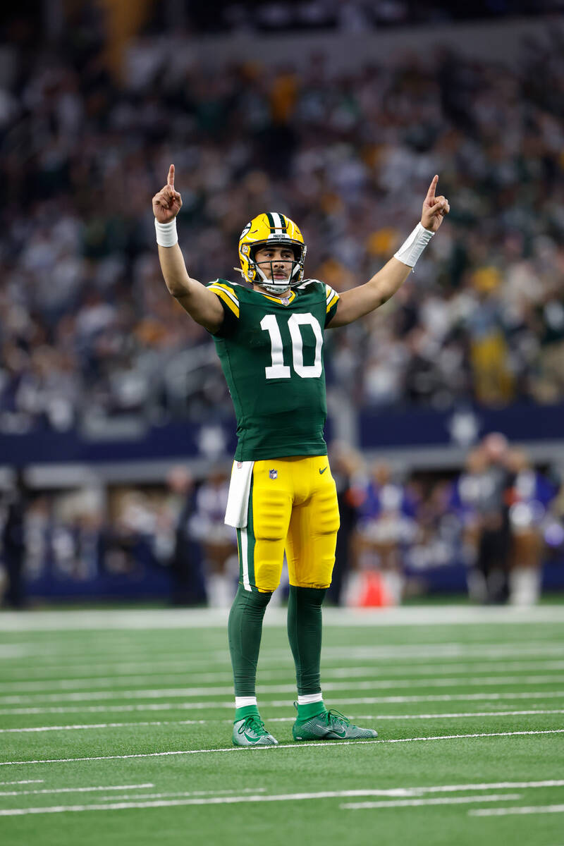 Green Bay Packers quarterback Jordan Love (10) celebrates after a touchdown during an NFL wild- ...