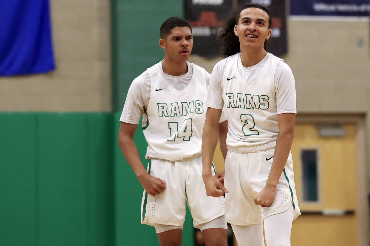 Rancho’s Jakoi Lide (2) and Caleb Roston (14) celebrate during the final seconds as they ...