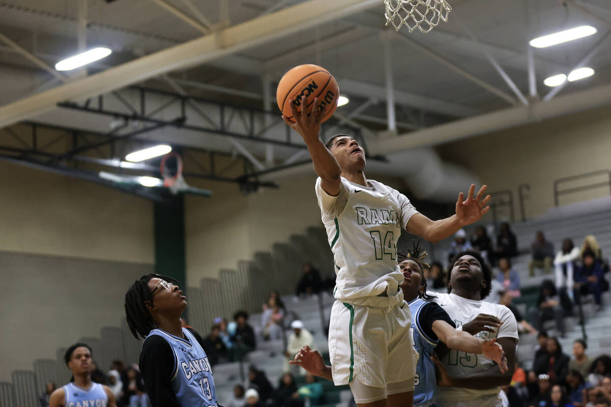Rancho guard Caleb Roston shoots a layup over Canyon Springs during the first half of a high sc ...