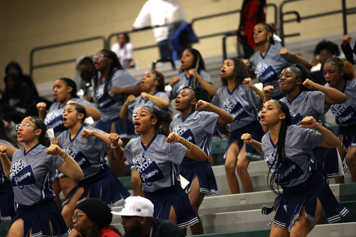 Canyon Springs’ cheerleaders pump up their team during the second half of a high school ...