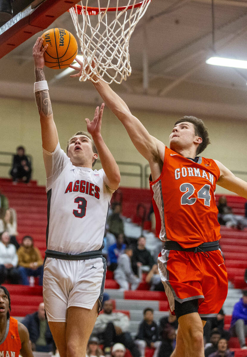 Arbor View guard Jalen Dickel (3) beats Bishop Gorman guard Ryder Elisaldez (24) to a lay up du ...