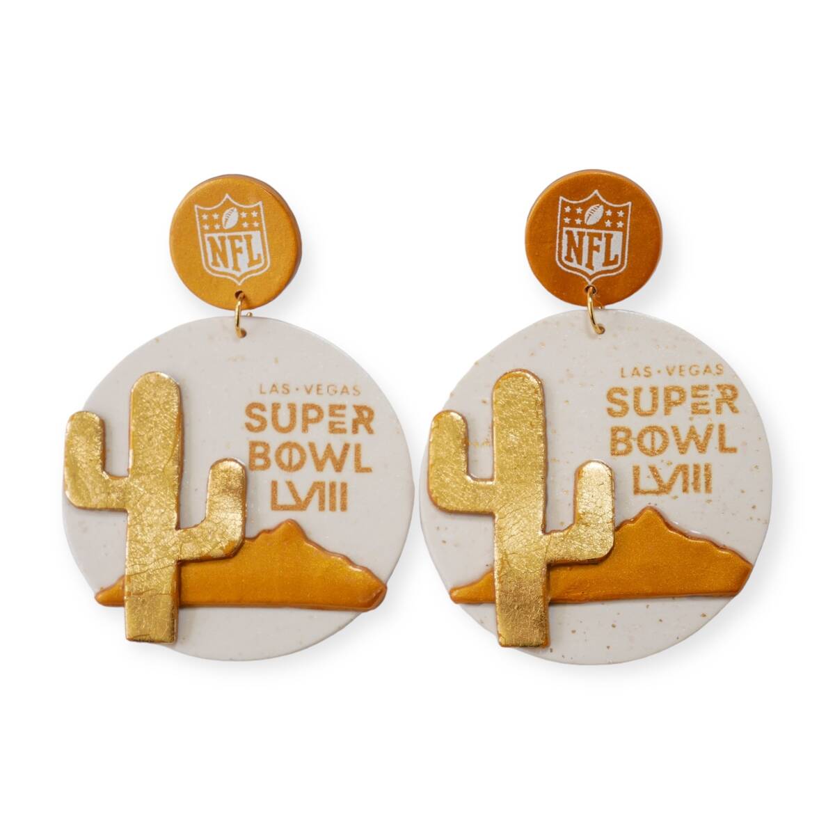 A pair of glittering gold earrings designed by the Las Vegas based Love, Hand and Heart company ...