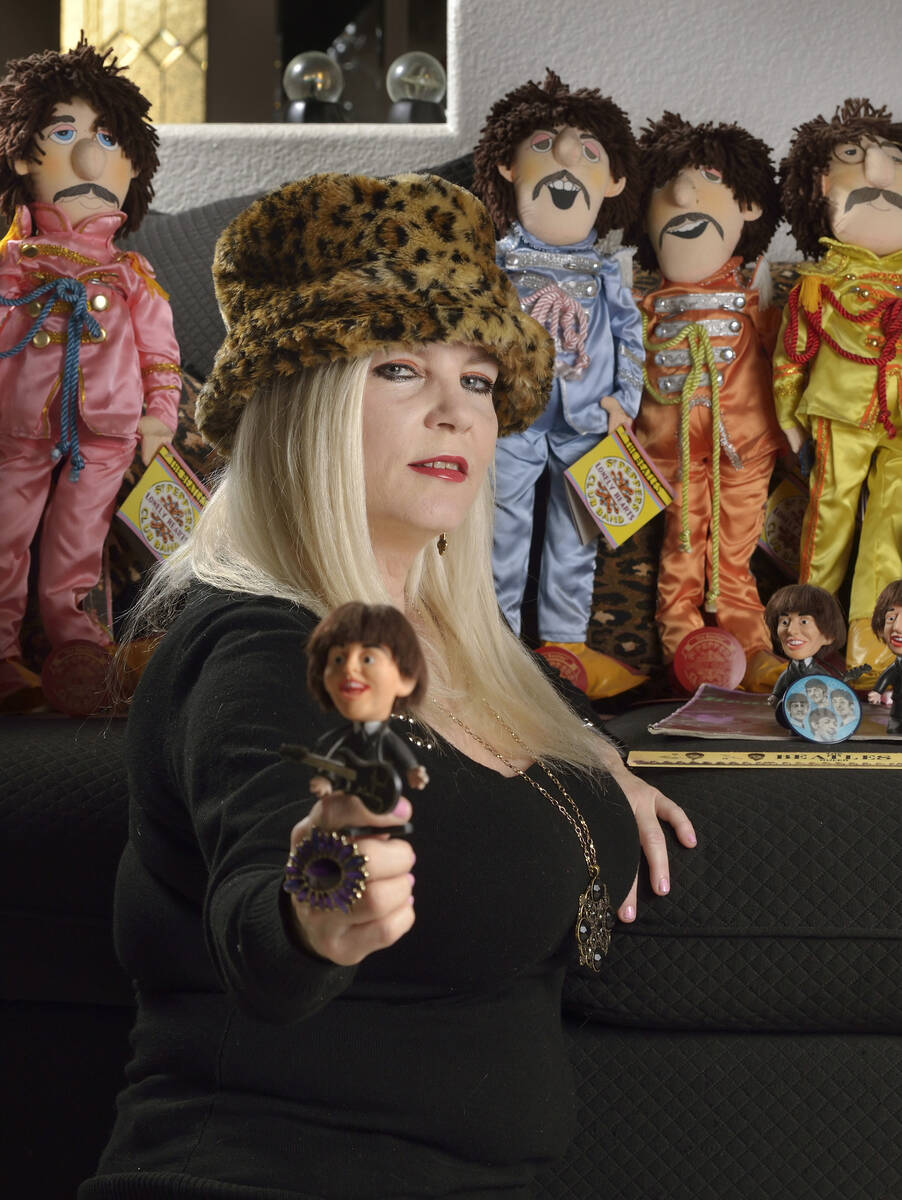 Sally Steele, editor and publisher of Vegas Rocks magazine, is shown with some of her Beatles m ...