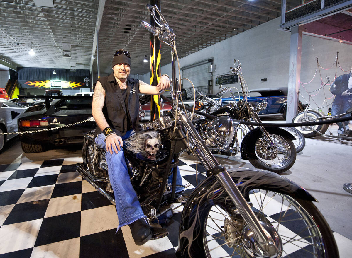 Danny Coker sits on one of his custom Harley choppers inside Count's Kustoms, Friday, April 22, ...