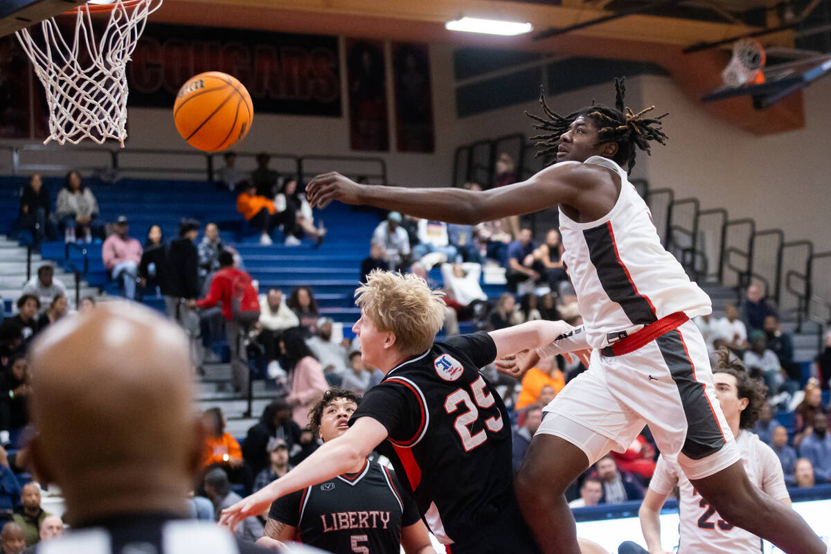 Arbor View’s Pharaoh Compton (5) attempts to rebound the ball during a basketball game b ...