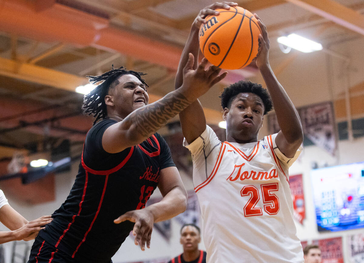 Coronado’s Tee Bartlett (13) and Bishop Gorman’s Caleb Williams (25) fight for th ...