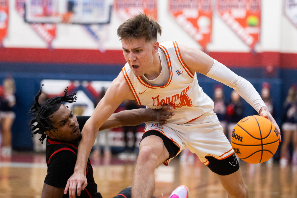 Bishop Gorman’s Ryder Elisaldez (24) drives past Coronado’s Josiah Cunningham (23 ...