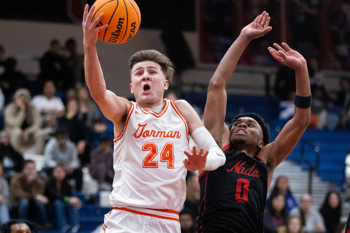 Bishop Gorman’s Ryder Elisaldez (24) goes in for a layup while Coronado’s Jonny C ...