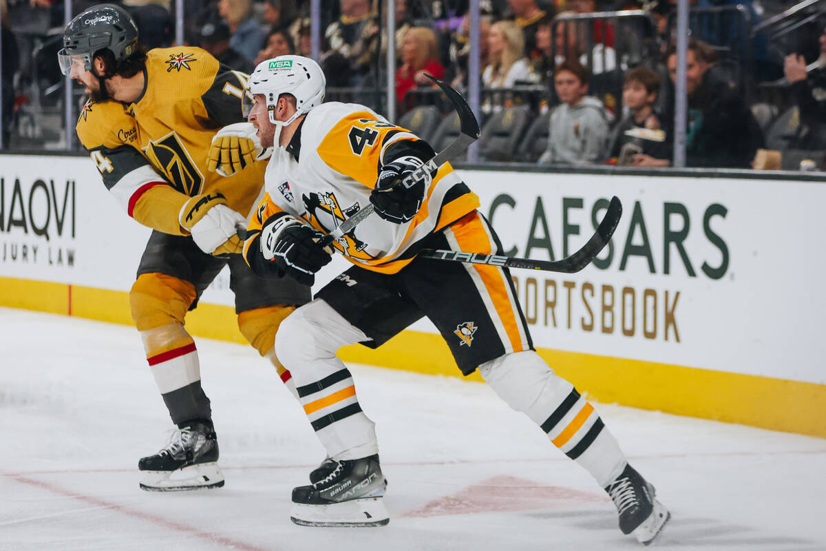 Pittsburgh Penguins center Jansen Harkins (43) and Golden Knights defenseman Nicolas Hague (14) ...