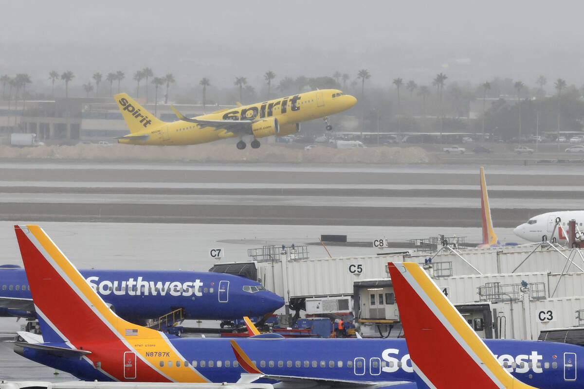 Fog lingers over Harry Reid International Airport as a Spirit Airways jet takes off Monday, Jan ...