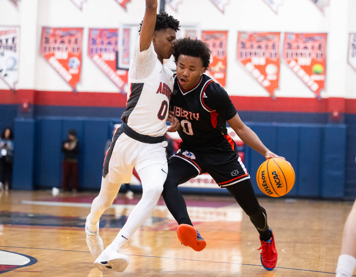 Liberty’s Tyus Thomas (0) attempts to drive the ball around Arbor View’s DeMarion ...