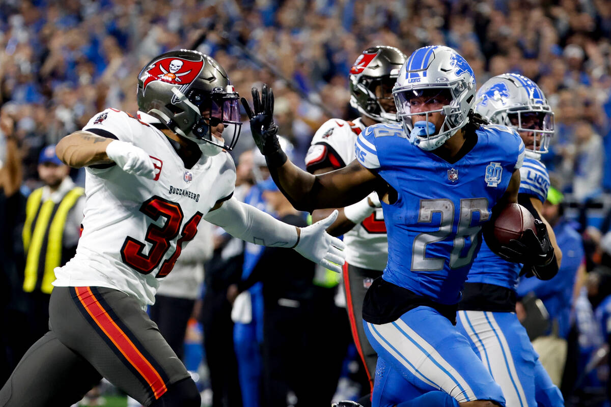 Detroit Lions running back Jahmyr Gibbs (26) rushes for a touchdown chased by Tampa Bay Buccane ...