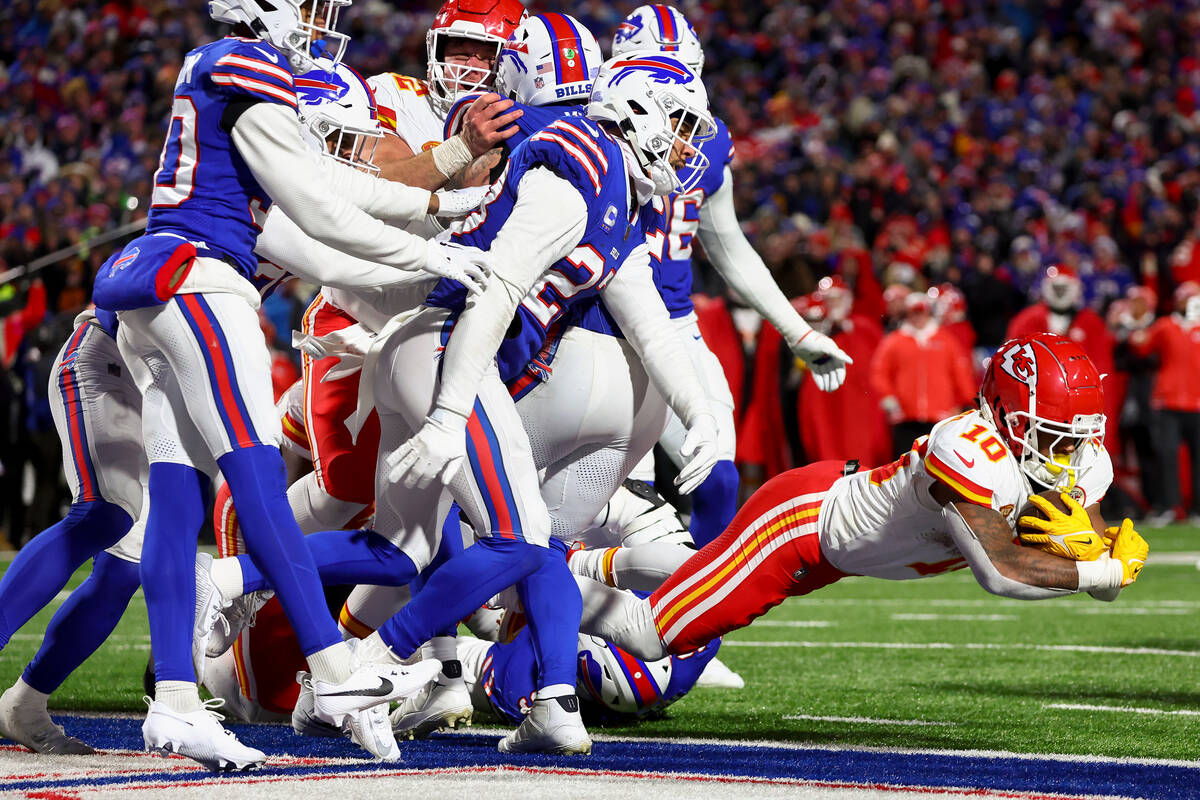 Kansas City Chiefs running back Isiah Pacheco (10) falls across the goal line for a touchdown a ...