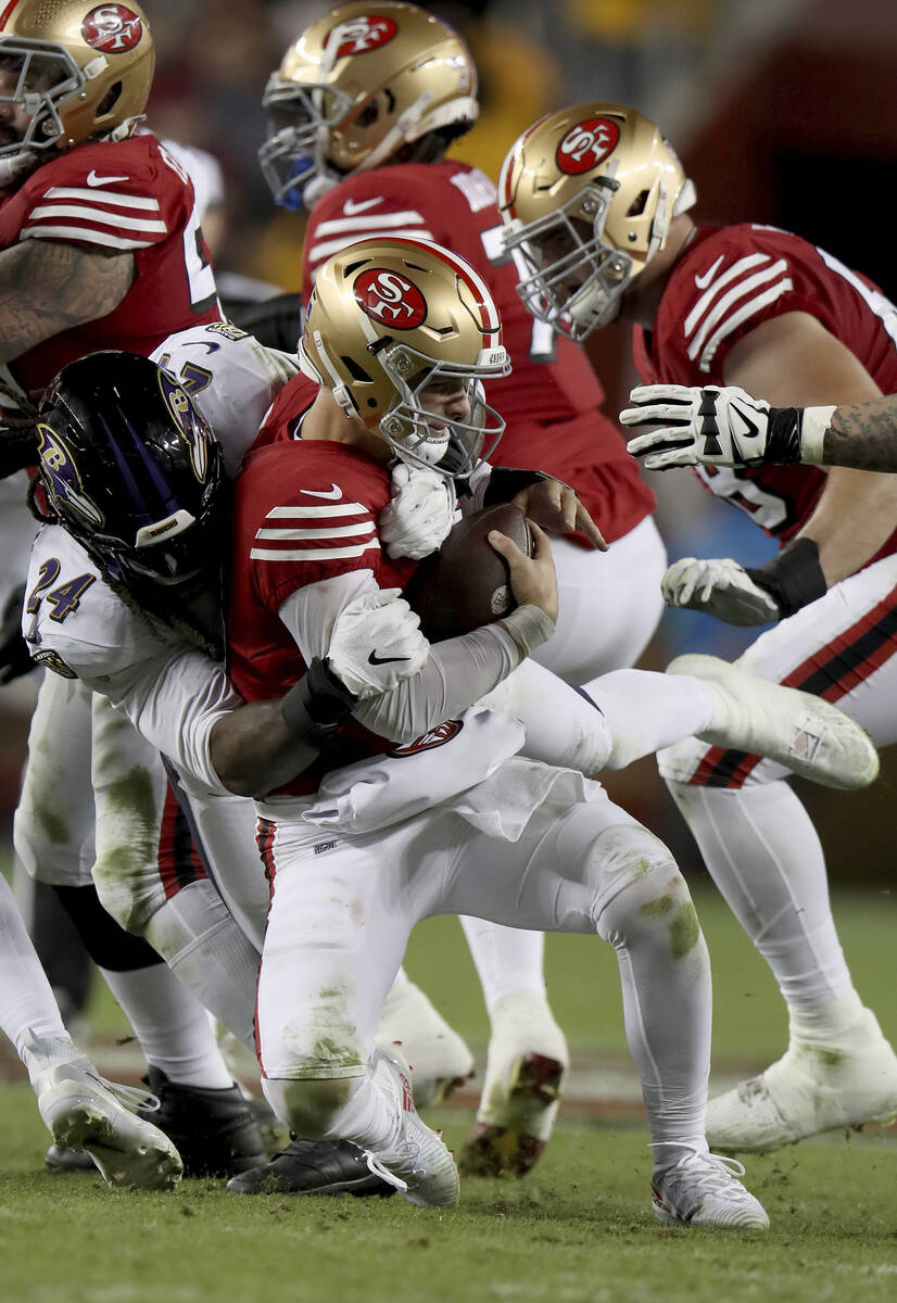 Baltimore Ravens linebacker Jadeveon Clowney (24) sacks San Francisco 49ers quarterback Brock P ...