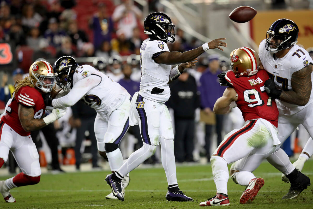 Baltimore Ravens quarterback Lamar Jackson (8) throws during an NFL football game against the S ...