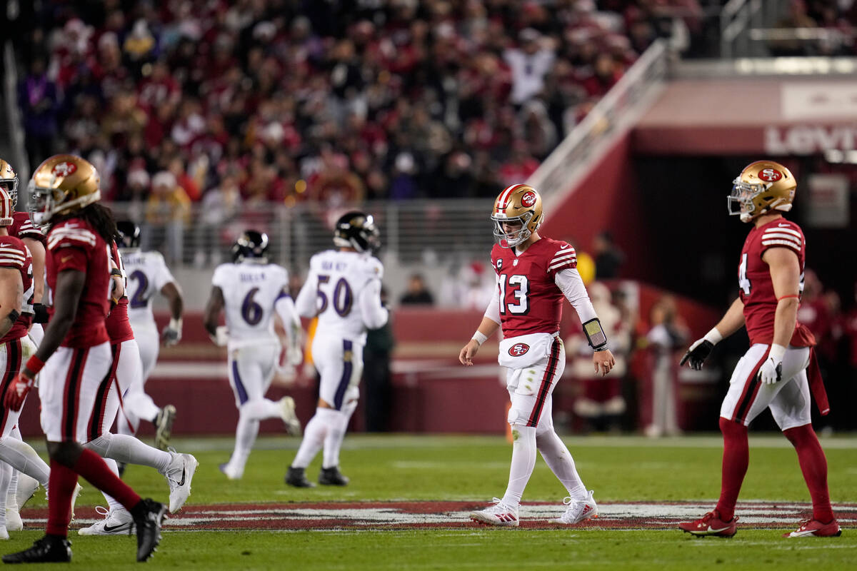 San Francisco 49ers quarterback Brock Purdy (13) walks to the sideline after throwing an interc ...
