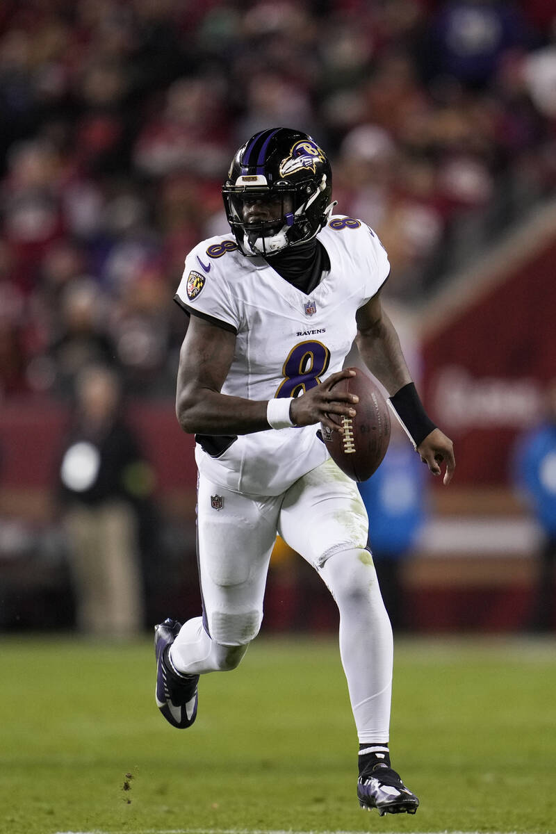 Baltimore Ravens quarterback Lamar Jackson looks for a receiver against the San Francisco 49ers ...
