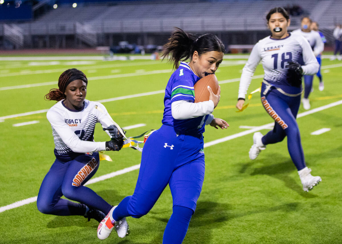 Legacy’s Samiyah Washington (2) pulls the flag off of Green Valley’s Dianna Rinca ...