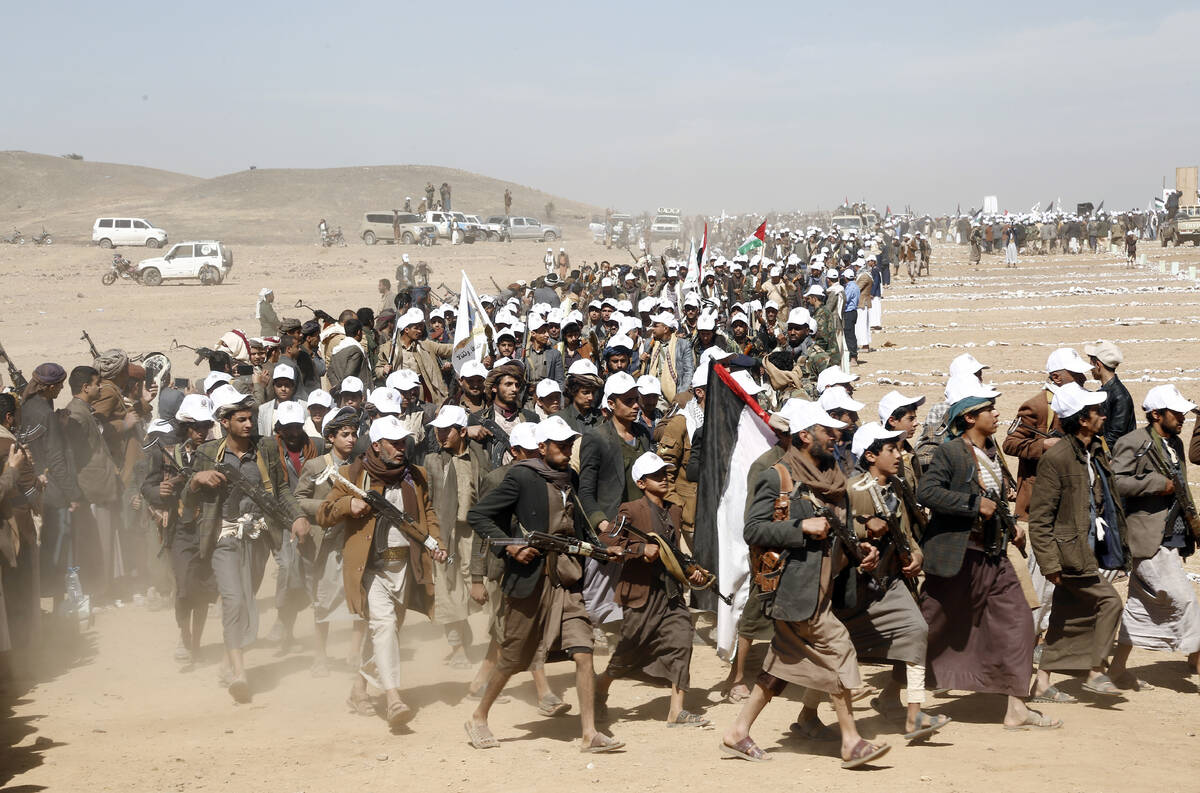 Houthi fighters march during a rally of support for the Palestinians in the Gaza Strip and agai ...