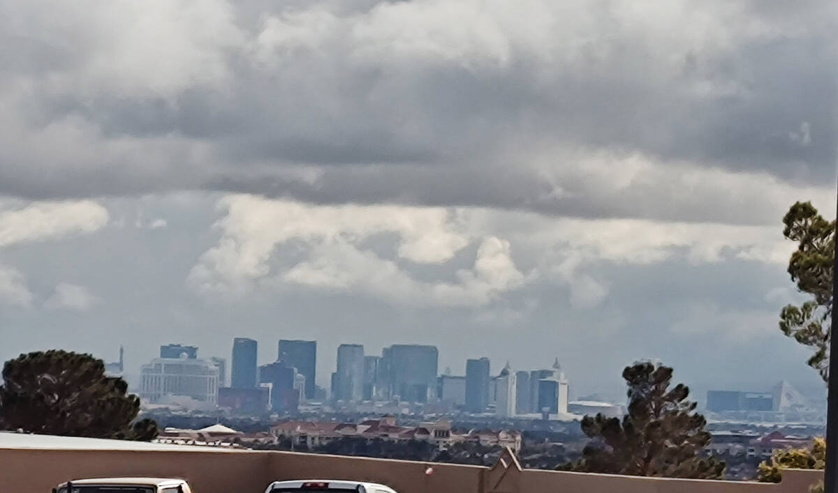 Clouds hang over the Las Vegas Strip shortly before noon on Tuesday, Jan. 23, 2024. (Marvin C ...