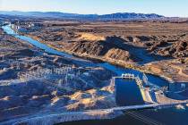 Morning lights the Davis Dam and beyond along the Colorado River on Jan. 28, 2023, north of Lau ...