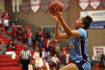 Centennial's Nation Williams (24) jumps for a layup during the second half of a high school bas ...