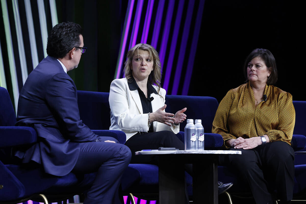 Renee Wilm, center, CEO of the Las Vegas Grand Prix, speaks as Betsy Fretwell, right, COO, Las ...