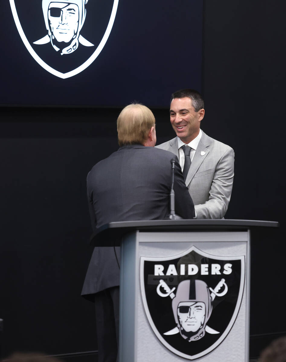 Raiders owner Mark Davis, left, introduces Tom Telesco as general manager during a press confer ...