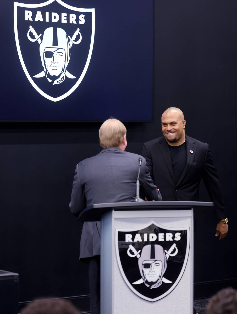 Raiders owner Mark Davis, left, introduces Antonio Pierce as general coach during a press confe ...