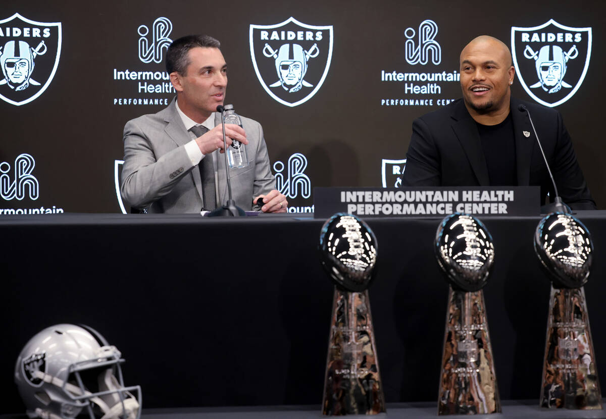 Tom Telesco, left, and Antonio Pierce are introduced as general manager and coach during a pres ...
