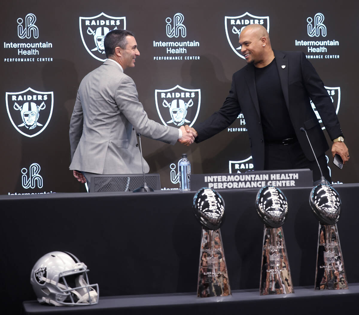 Tom Telesco, left, and Antonio Pierce are introduced as general manager and coach during a pres ...