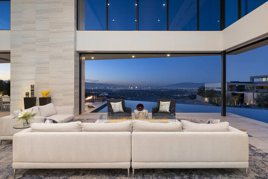 High ceilings and glass walls are one of the prominent features of the residence. (Photo courte ...