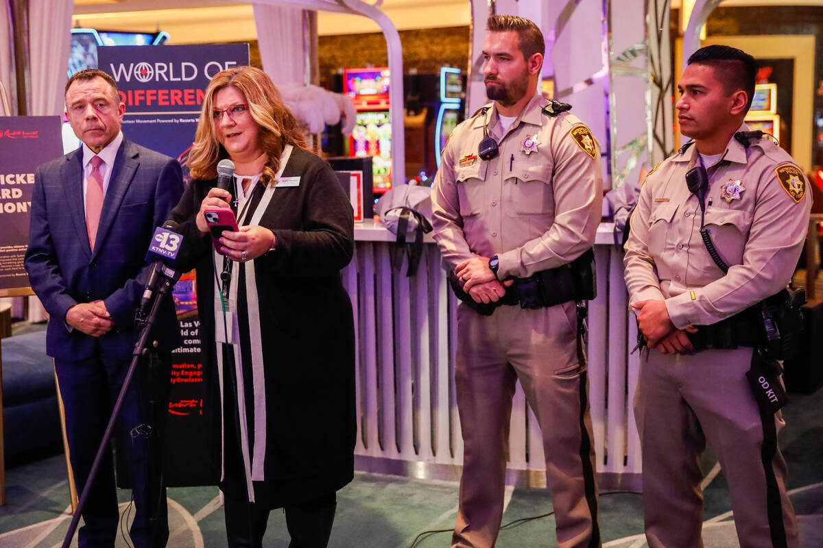 Karen Marben, executive director of the LVMPD Foundation, honors officers Jacob Noriega and Ty ...