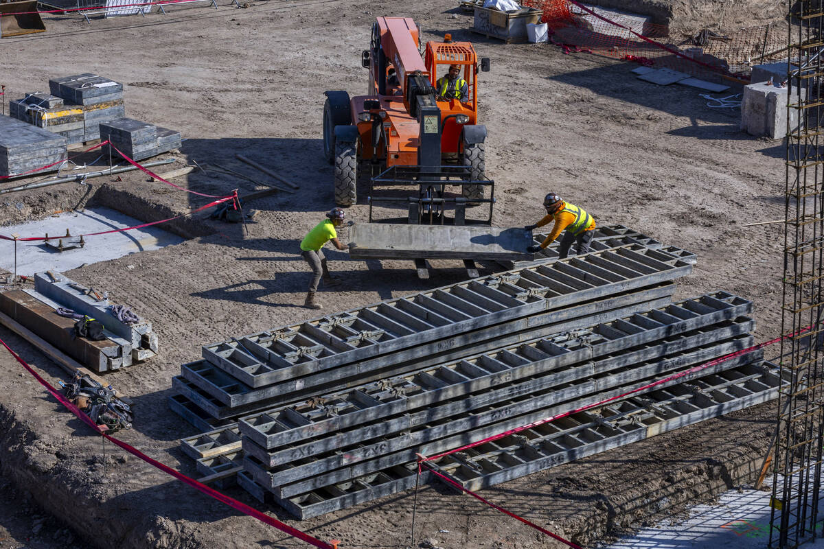 A construction crew works to develop dual hotels during the AC/Element Symphony Park Hotel grou ...