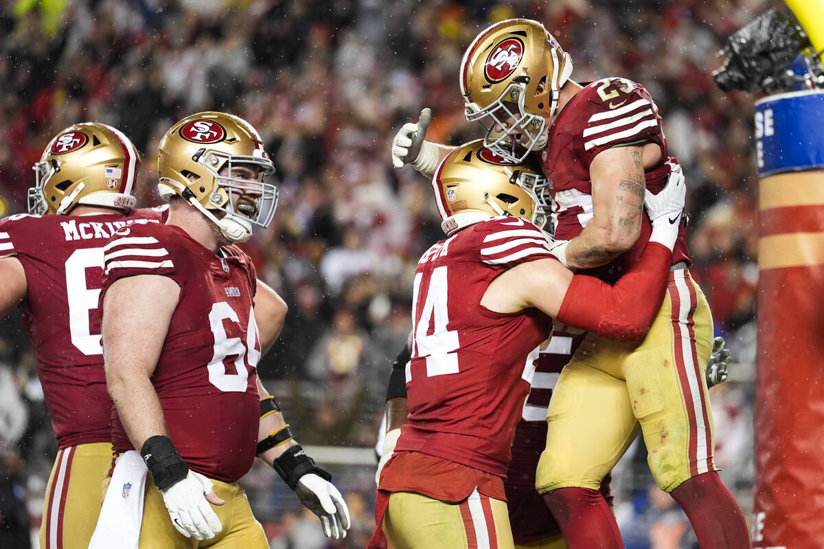 San Francisco 49ers running back Christian McCaffrey (23) celebrates with fullback Kyle Juszczy ...