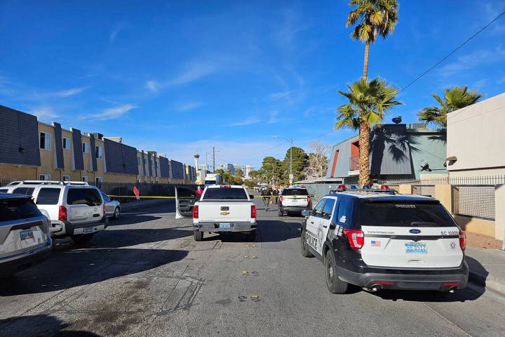 Police at the scene of a homicide on Friday, Jan. 25, 2024, on a sidewalk in the 3700 block of ...