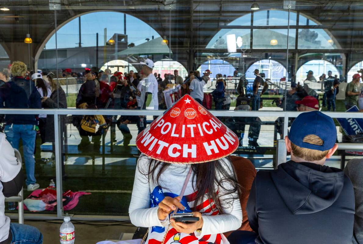 Supporter Kimberly Nguyen of Pasadena waits patiently for the arrival of Republican presidentia ...