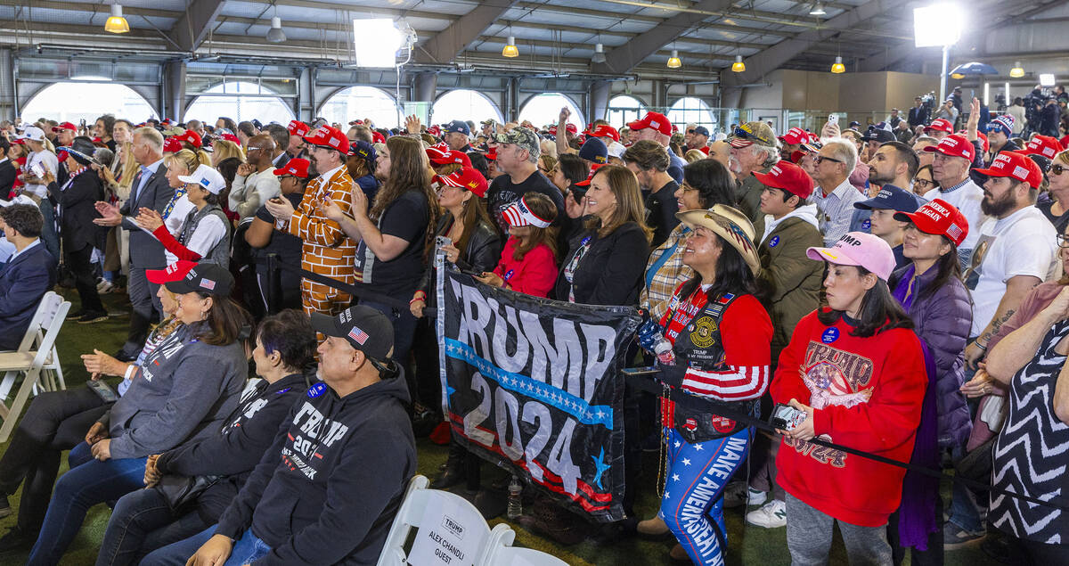 Supporters applaud as Republican presidential candidate former President Donald Trump speaks du ...