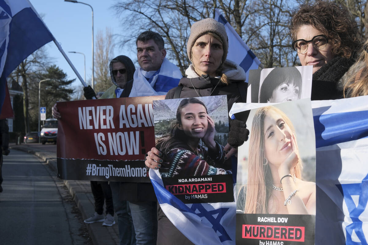Pro-Israel activists gather near the International Court of Justice, or World Court, in The Hag ...