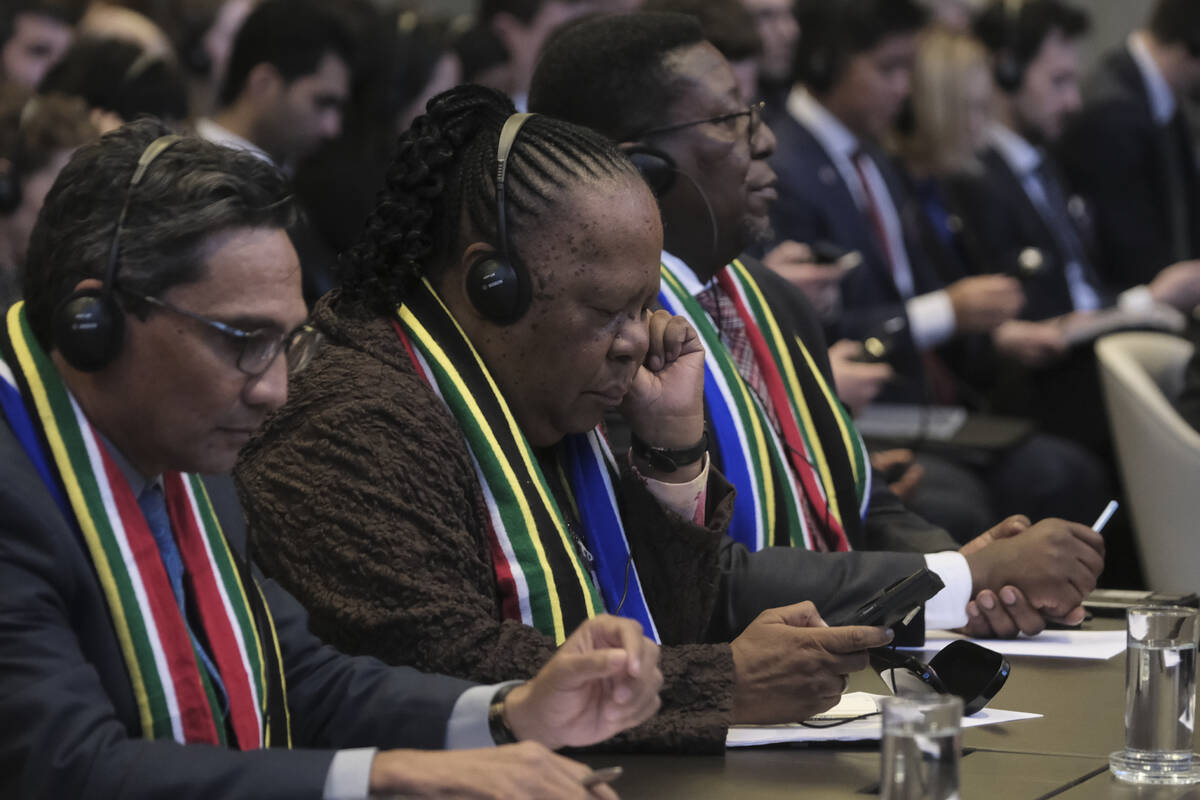 South Africa's Foreign Minister Naledi Pandorthe, centre, attends the session of the Internatio ...