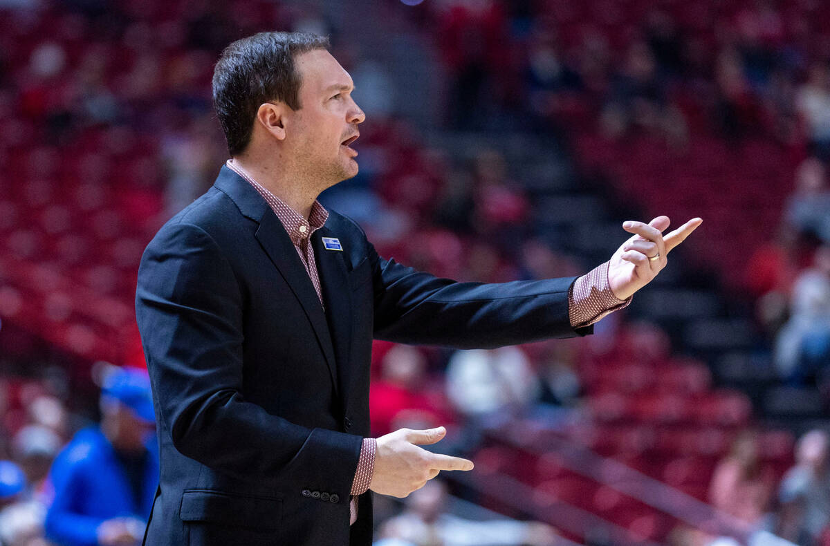 UNLV head coach Kevin Kruger is dismayed by the lack of another apparent foul call on the Air F ...