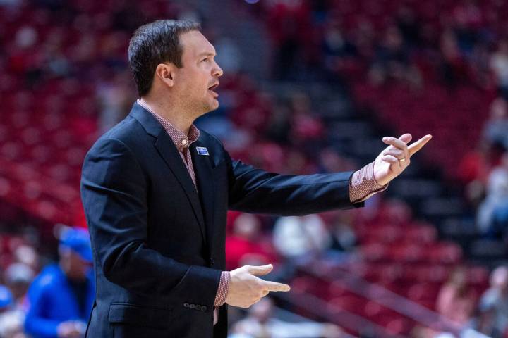 UNLV head coach Kevin Kruger is dismayed by the lack of another apparent foul call on the Air F ...