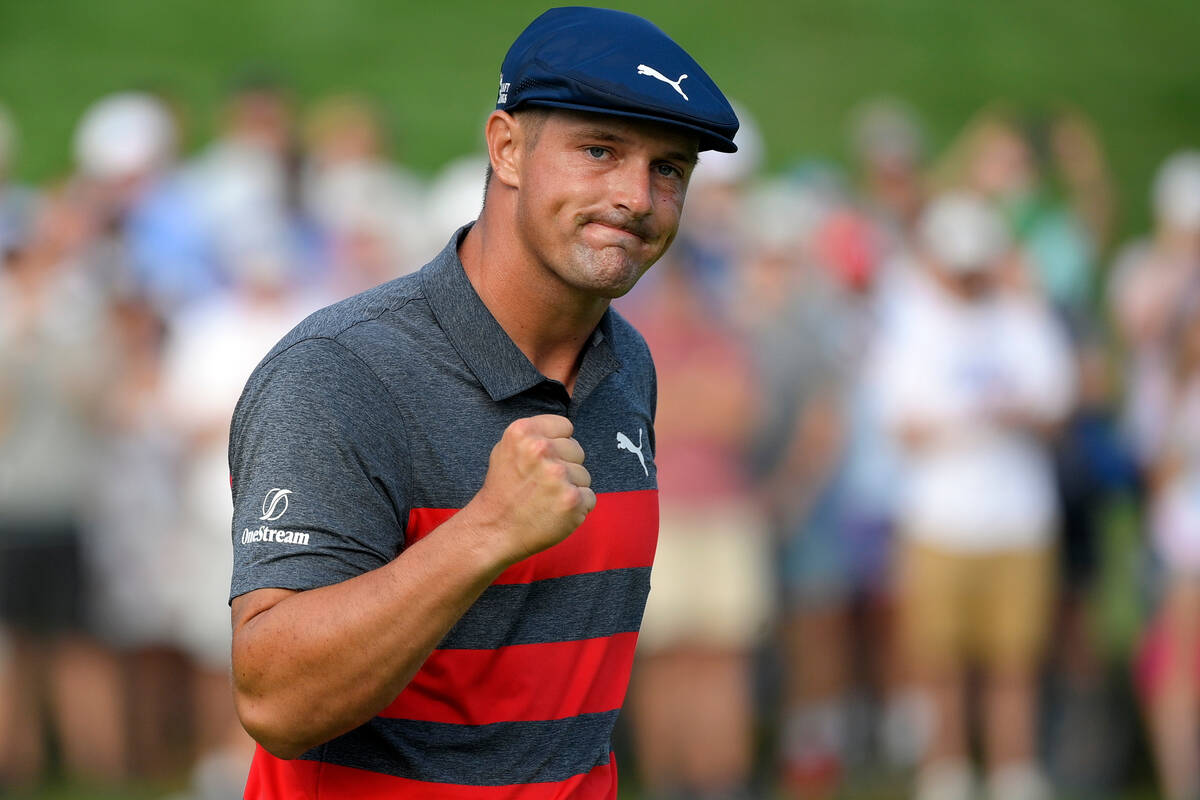 FILE- In this Aug. 29, 2021, file photo, Bryson DeChambeau reacts after sinking his putt on the ...